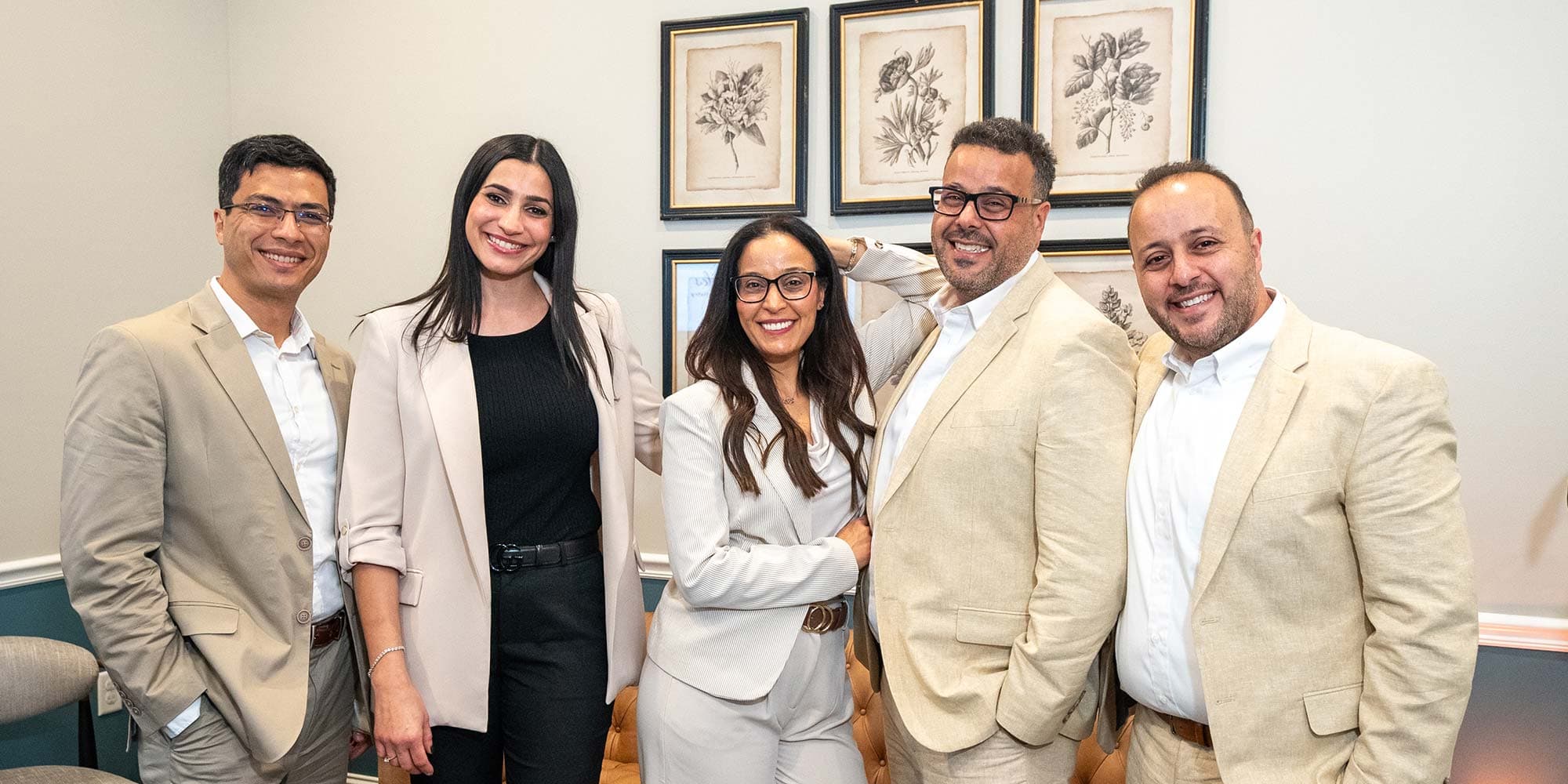 Dentists with happy young patient at a Calgary family dental practice